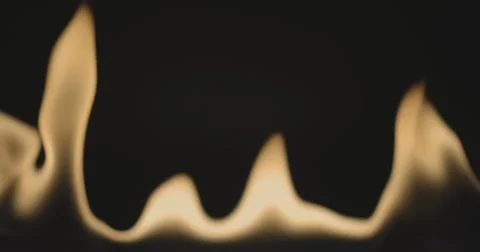 Fire dancing against dark background 120fps slow motion loopable footage Foto stock