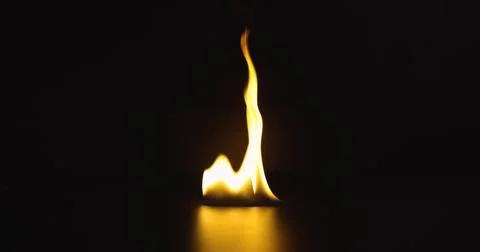 Fire dancing against dark background 120fps slow motion loopable footage Foto stock