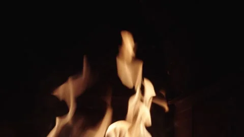 Fire dancing in a cozy fireplace during a winter evening Stock Footage 329964613