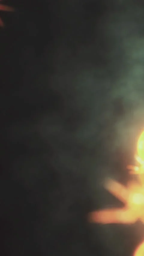 Fire dancing performance takes place at night under a smoky sky Stock Footage 336173911
