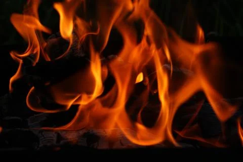 Fire on dark background, red light, orange Foto stock