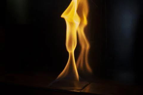 Fire in dark. Flame on black background. Alcohol burning. Stock Photos