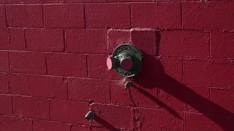 Fire department connection on red brick wall Stock Footage 312373845