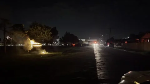 Fire Dept Putting out Dumpster Fire on 4th of July Stock Footage 264184128