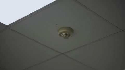 Fire Detection Sensor hangs on roof inside office near ventilation system. Stock Footage 262092240