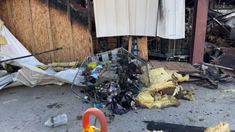 Fire at a Dollar General Store burned inventory Stock Footage 333780814