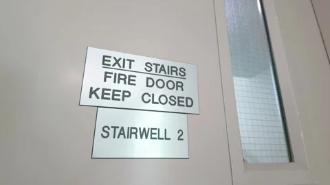 Fire door keep closed sign on exit stairs in building stairwell Stock Footage 333223319