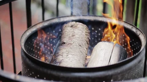 Fire Drum with Burning Logs and Bright Flames and Smoke Video stock 58907027