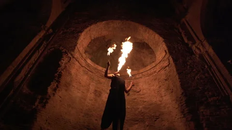 Fire eater makes a fire show Stock Footage 230686706