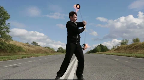 The fire eater, the rotation of fireballs Stock Footage 67958918