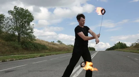 The fire eater, the rotation of fireballs Stock Footage 67959001