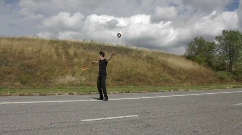 The fire eater, the rotation of fireballs Stock Footage 67959244