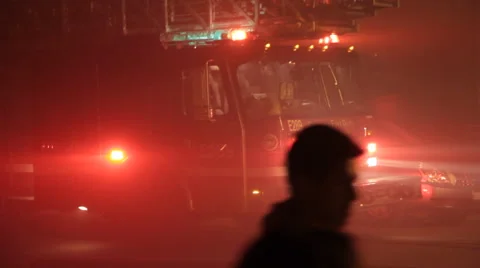 Fire engine and fire fighters surrounded by smoke Stock Footage 42267254