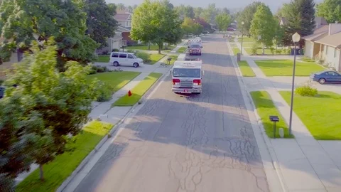 Fire Engine arriving at a house fire with drone following Video stock 104879377