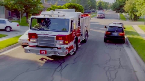 Fire Engine arriving at house fire Stock Footage 104879471