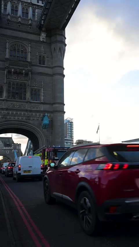 Fire Engine Crossing Tower Bridge at Sunset Stock Footage 325716822