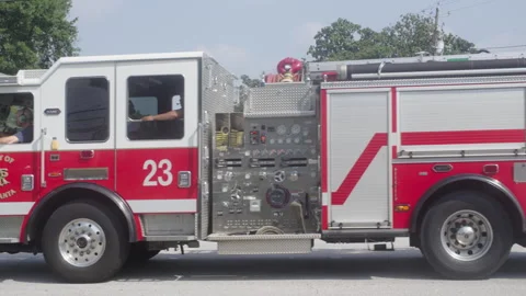 Fire Engine driving down street 動画素材 276185799