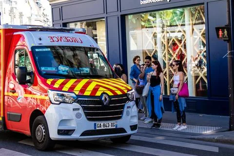 Fire engine driving through the streets of Paris Stock Photos