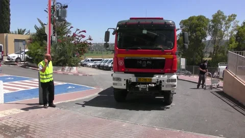 A fire engine enters the first gate of prison for rescuing prisoners Stock Footage 133534729