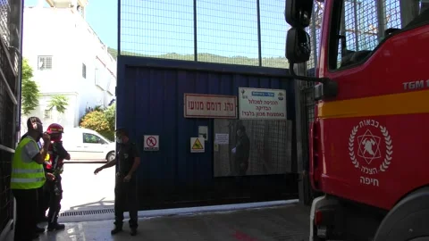 A fire engine enters the second gate of prison for rescuing prisoners Stock Footage 133535011