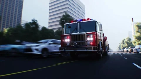An fire engine, fire rescue driving fast on a city street. Stock Footage 328543673