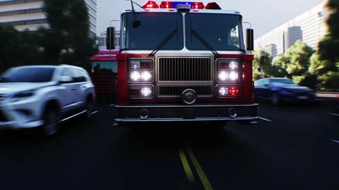 An fire engine, fire rescue driving fast on a city street. Stock Footage 328543826