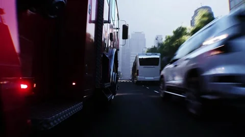 An fire engine, fire rescue driving fast on a city street. Stock Footage 328544087