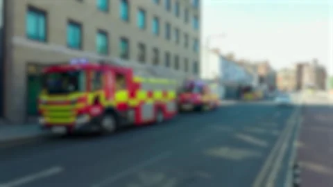 Fire engine with flashing lights beside city road and approaching car. Emergency Video stock 345501091
