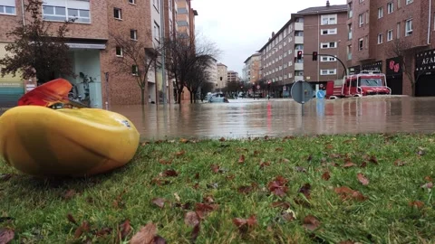 A fire engine forms small waves in Ochagava street. Stock Footage 273256567