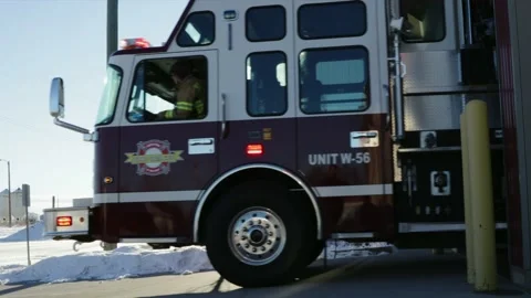 Fire engine leaving fire station Stock Footage 220205383