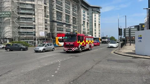 Fire engine with lights flashing on city street, Sunderland, England Stock Footage 314325709