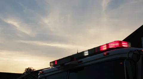 Fire engine lights at sunset Stock Footage 66548756