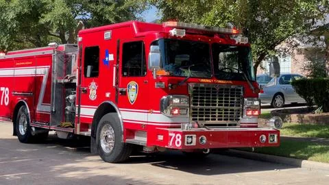 A Fire engine in a neighborhood. Stock Photos