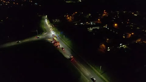 Fire Engine at night with blue flashing lights Harlow Essex UK drone aerial view Stock Footage 345153909