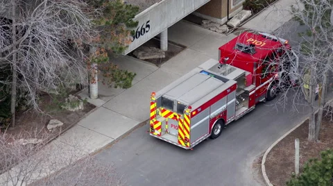 Fire Engine P101 is seen in front of a apartment building Stock Footage 48954503