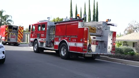 Fire Engine parked on street with flashing red lights Stock Footage 328487603