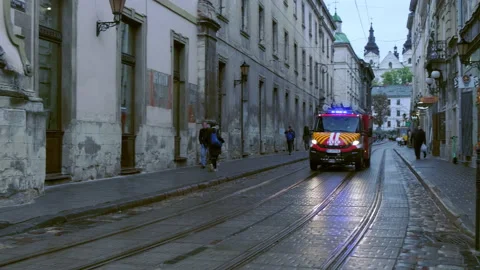 Fire engine speeding through Rynok Square, Lviv Stock Footage 166994576