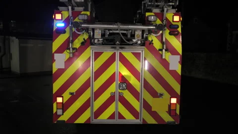 Fire engine truck emergency flashing blue lights. UK Stock Footage 330399342