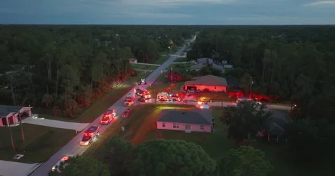 Fire engine trucks and ambulance vehicles responding to fire alarm at night Stock Footage 329141658