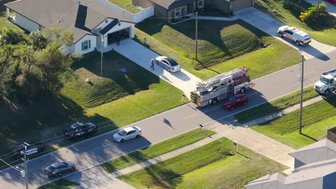 Fire engine trucks and ambulance vehicles responding to fire alarm Stock Footage 329142849