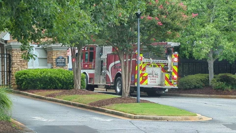 Fire Engine Trucks and Ambulance Vehicles Responding to Fire Alarm. Investi.. Video stock 336663610