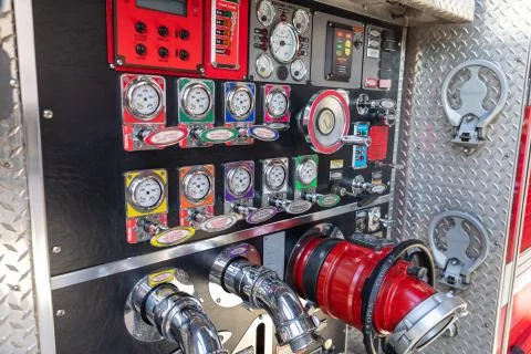 Fire Engine valve and pump panel with hose conenctions Stock Photos