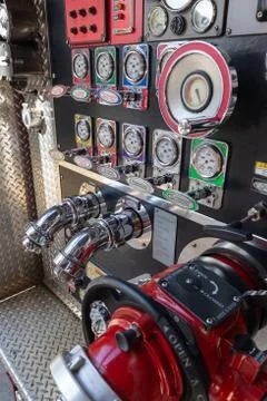Fire Engine valve and pump panel with hose conenctions Foto stock