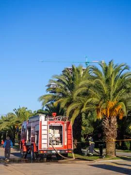 Fire engine at work. Pumps pump water. Fire extinguishing. Fire engine in a.. Stock Photos