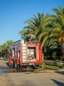 Fire engine at work. Pumps pump water. Fire extinguishing. Fire engine in a.. Stock Photos