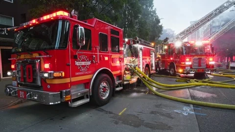 Fire engines with hoses at active Seattle fire Stock Footage 280801862