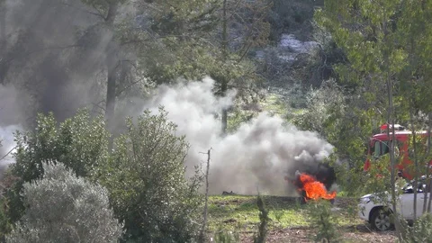 Fire engines spraying water to a fire zone in Mt. Carmel, Israel 스톡 동영상 99809361