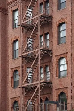 A fire escape of an apartment building in New York city. Stock Photos