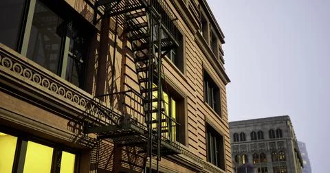 Fire escape on a city building at sunset with contrasting warm hues Illustrazione stock