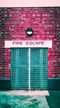 Fire Escape Door on Brick Wall Stock Photos